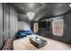 A living room showcasing dark gray walls, modern decor, plush seating, and natural light at 2625 Lake Erma Dr, Hampton, GA 30228