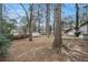 Large backyard with mature trees and storage shed at 3310 Chisholm Sw Trl, Marietta, GA 30060