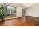 Hardwood floor living room with sliding glass doors to backyard at 3310 Chisholm Sw Trl, Marietta, GA 30060