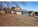 Houses on a hillside, showcasing curb appeal and neighborhood context at 3815 Landgraf Cv, Decatur, GA 30034