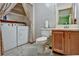 Bathroom with toilet, sink, and built-in shelves at 3815 Landcraf Cv, Decatur, GA 30034