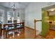 Dining room with hardwood floors, bay window, and view to living room at 3815 Landgraf Cv, Decatur, GA 30034