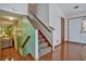 Spacious entryway with hardwood floors and staircase to upper level at 3815 Landgraf Cv, Decatur, GA 30034