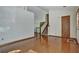 Living room with hardwood floors, staircase, and a view to dining area at 3815 Landcraf Cv, Decatur, GA 30034