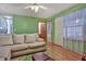 Living room with beige couch and wood floors at 3815 Landcraf Cv, Decatur, GA 30034