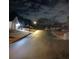 Night street view showing the neighborhood with well-lit streets and houses at 3815 Landgraf Cv, Decatur, GA 30034