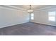 Spacious bedroom with carpet flooring and a chandelier at 5015 Montes Ln, Cumming, GA 30040