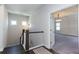 Upstairs hallway with carpet and access to bedrooms at 5015 Montes Ln, Cumming, GA 30040