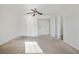 Bright bedroom featuring ample closet space and a ceiling fan at 6738 Merrywood Dr, Fairburn, GA 30213