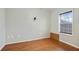 Simple bedroom with wood-look floors and a window at 6738 Merrywood Dr, Fairburn, GA 30213