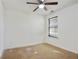 Simple bedroom featuring a ceiling fan and window at 6738 Merrywood Dr, Fairburn, GA 30213