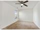 Well-lit bedroom with ceiling fan and window coverings at 6738 Merrywood Dr, Fairburn, GA 30213