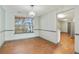 Simple dining room with hardwood floors and access to kitchen at 6738 Merrywood Dr, Fairburn, GA 30213