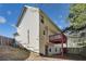 House exterior with wooden deck and fenced yard at 6738 Merrywood Dr, Fairburn, GA 30213