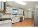 Kitchen with white cabinets and stainless steel appliances at 6738 Merrywood Dr, Fairburn, GA 30213