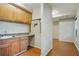 Small kitchenette with wood cabinets and a sink at 6738 Merrywood Dr, Fairburn, GA 30213