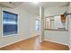 Basement living area with wood flooring and kitchenette access at 6738 Merrywood Dr, Fairburn, GA 30213