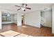 Spacious living room with hardwood floors and ceiling fan at 6738 Merrywood Dr, Fairburn, GA 30213