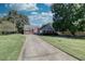 Brick ranch home with a large front yard and driveway at 1809 Francon Sw Ct, Conyers, GA 30094