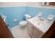 Small bathroom with blue tile and white vanity at 2283 Country Club Sw Ln, Atlanta, GA 30311