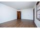 Simple bedroom with hardwood floors and an open door at 2283 Country Club Sw Ln, Atlanta, GA 30311