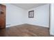 Simple bedroom with hardwood floors and window at 2283 Country Club Sw Ln, Atlanta, GA 30311