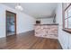 Bright dining room features hardwood floors and a brick breakfast bar at 2283 Country Club Sw Ln, Atlanta, GA 30311