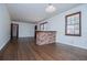 Bright dining room features hardwood floors and a brick breakfast bar at 2283 Country Club Sw Ln, Atlanta, GA 30311