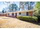 Brick ranch house with a landscaped yard at 2283 Country Club Sw Ln, Atlanta, GA 30311