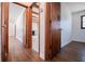 Hardwood floor hallway with doors to other rooms at 2283 Country Club Sw Ln, Atlanta, GA 30311