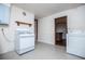 Kitchen features white appliances and light blue cabinets at 2283 Country Club Sw Ln, Atlanta, GA 30311