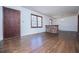 Spacious living room with hardwood floors and brick half wall at 2283 Country Club Sw Ln, Atlanta, GA 30311