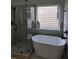 Bathroom features a freestanding tub and frameless shower at 28 Samuel Nw Way, Cartersville, GA 30121