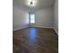 Simple bedroom with hardwood floors and a window at 28 Samuel Nw Way, Cartersville, GA 30121