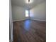 Bright bedroom featuring hardwood floors and a large window at 28 Samuel Nw Way, Cartersville, GA 30121