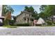 Two-story home featuring a 'For Sale' sign, covered front porch, and manicured landscaping at 301 Fortune Ne St, Atlanta, GA 30312