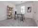 Home office showcasing a desk, shelving, and neutral decor with natural light from large window at 301 Fortune Ne St, Atlanta, GA 30312