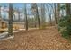 Large backyard with mature trees and wooded area at 332 Stonecutters Cv, Stockbridge, GA 30281