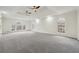 Large bedroom with multiple windows and a high ceiling at 332 Stonecutters Cv, Stockbridge, GA 30281