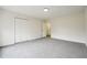 Bright bedroom featuring grey carpet and ample closet space at 332 Stonecutters Cv, Stockbridge, GA 30281