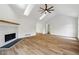 Bright living room with vaulted ceiling, fireplace, and hardwood floors at 332 Stonecutters Cv, Stockbridge, GA 30281