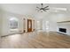 Living room with hardwood floors and large windows at 332 Stonecutters Cv, Stockbridge, GA 30281