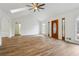 Open living area with hardwood floors and a wood accent wall at 332 Stonecutters Cv, Stockbridge, GA 30281