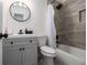 Modern bathroom with gray tile and a white vanity at 537 N Cedar N Ct, Riverdale, GA 30274