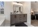 Modern bathroom with double vanity and a soaking tub at 537 N Cedar N Ct, Riverdale, GA 30274