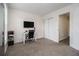 Bright bedroom with a desk and double door closet at 537 N Cedar N Ct, Riverdale, GA 30274