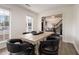 Dining room with a large wooden table and black leather chairs, hardwood floors at 537 N Cedar N Ct, Riverdale, GA 30274