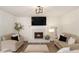 Living room with a marble fireplace and built-in shelving at 537 N Cedar N Ct, Riverdale, GA 30274