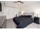 Bright main bedroom featuring a king-size bed and ensuite access at 537 N Cedar N Ct, Riverdale, GA 30274