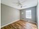 Simple bedroom with ceiling fan and large window at 5912 Jacobs Rd, Acworth, GA 30102